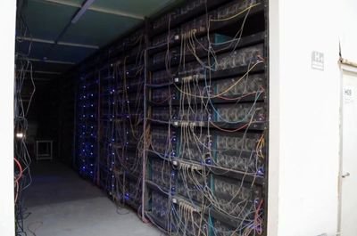 Modern mining farm hosting numerous Zcash mining rigs in a climate-controlled facility